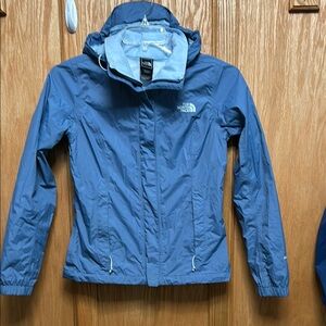 The North Face Women's Blue, hooded rain Jacket.